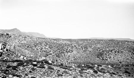 Looking due east with damsite in middle foreground and El Portezuelo in middle background