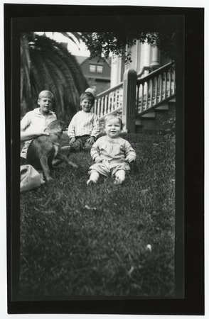 Three young Fletcher children on grass