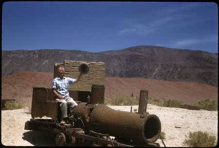 Howard E. Gulick on old locomotive at Las Flores