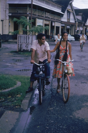 [Man and woman on bicycles]