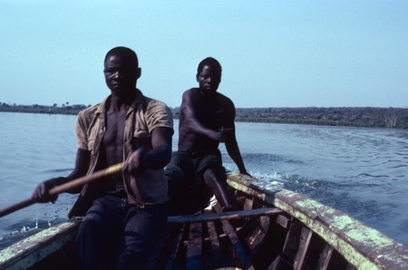 Two fishermen Paddle small boat on Lake Mweru Wantipa, Kaputa District