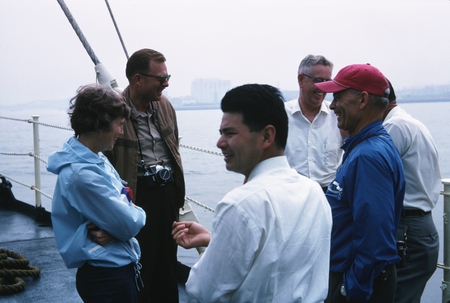 Captain Alan Phinney (brown jacket) talks with Jean Zobell, Claude Zobell (red cap). Zetes Expedition, June 1966