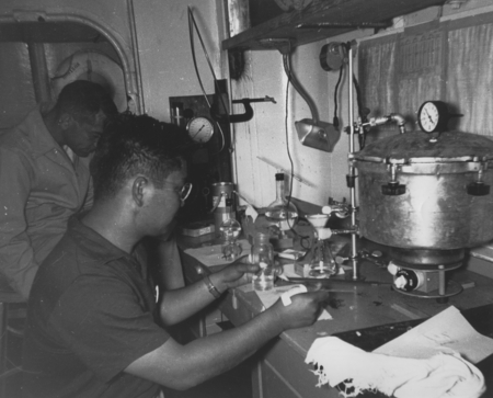 R/V Horizon Chemical Lab. Left to right: Sidney Rittenberg, Dick Morita