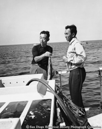 Representatives of Japan Traders Club posing on boat with fish catch
