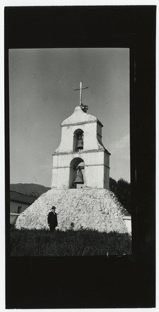 Man in front of the bell tower at Pala Mission