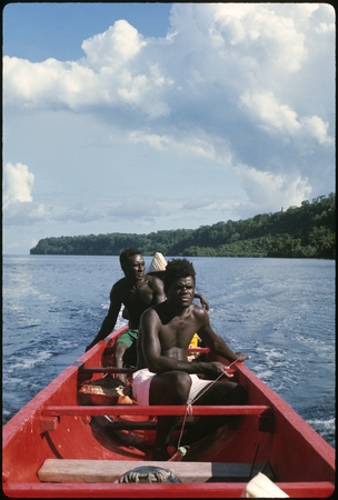 Three men on canoe