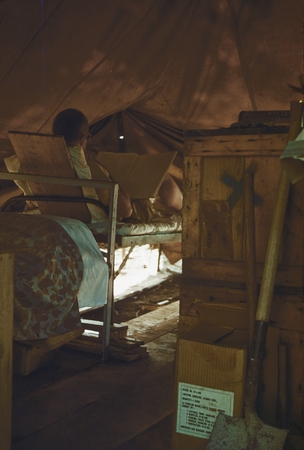 Jeff Holter in bed in encampment