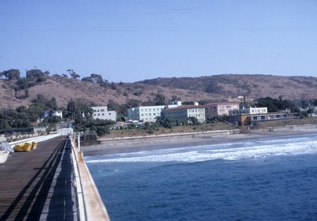 Scripps Institution of Oceanography and surrounding hills as seen from the original wooden Scripps pier. October 13, 1958.