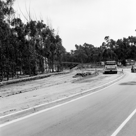 Construction of Gilman Drive on UC San Diego campus, near pedestrian bridge