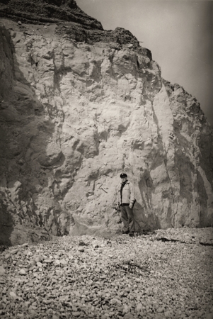 Richard Howell Fleming at cliff. Gulf of California Expedition, 1939
