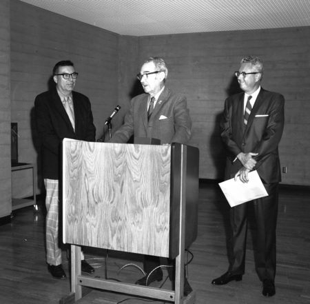Herbert York (left), Francis Smith (center) and an unidentified man during ceremony commemorating the 3/4 million books at...