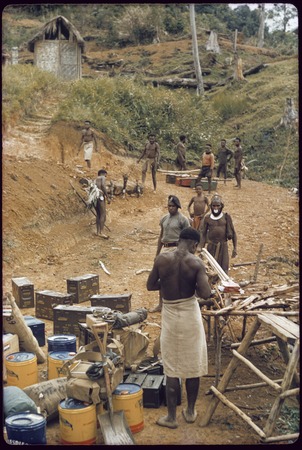 Tabibuga, men preparing to move cargo to Kwiop