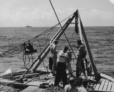 Russell W. Raitt, Roger Revelle, and others at seismic station aboard R/V Horizon, MidPac Expedition