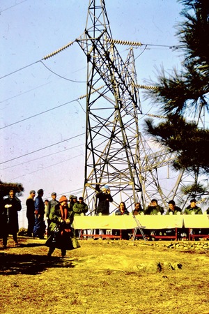 Meeting with Chinese officials under a transmission tower (2 of 2)