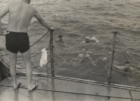 In water: A. Gilkey, crewman, H. Dahlgren, Capt. Vernon Wyatt