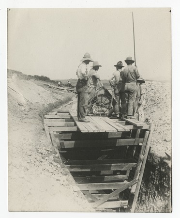 Laborers on top of San Diego flume