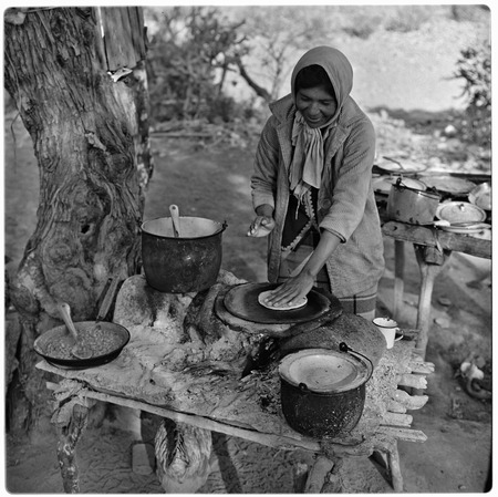 Woman cooking in outside kitchen at Rancho Las Tinajitas, the nearest ranch to the San Borjitas cave