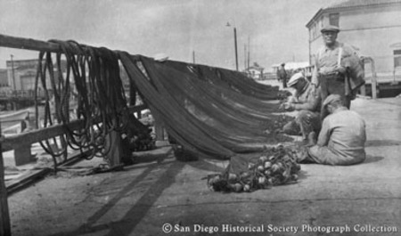 Mending fishing nets on San Diego waterfront