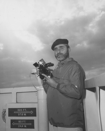 Sid Schulman, the first mate aboard the D/V Glomar Challenger (ship) using a sextant during the Deep Sea Drilling Project....