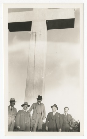 Group portrait of men standing near Mount Helix cross