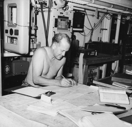 Russell W. Raitt works on seismic records aboard R/V Spencer F. Baird
