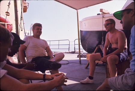 Crew relaxing onboard the USC&amp;GS Pioneer during the International Indian Ocean Expedition. 1964