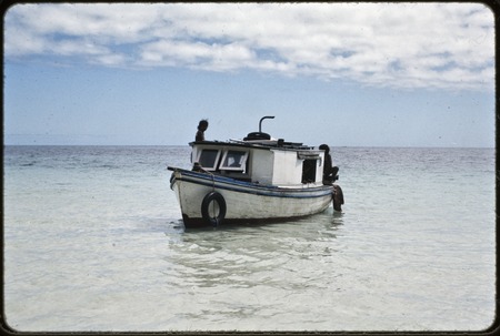 Small boat in shallow water, Munuwata Island