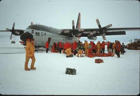 Scientific party arriving at McMurdo Station, Antarctica, via a Lockheed Hercules C130 airplane