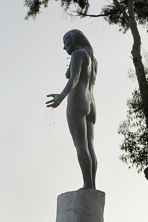 Standing: view of bronze figure from the side