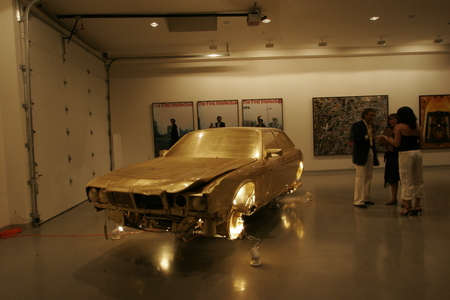 The Jewel / In God We Trust: junk car covered in gold leaf at the haudenschild Garage: auction night