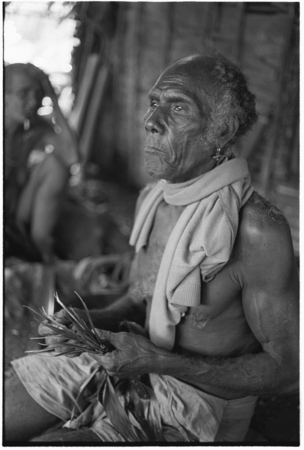 Folofo&#39;u holds knotted divining leaves as he and his wife Boori&#39;au ponder possible causes of a grandchild&#39;s illness.