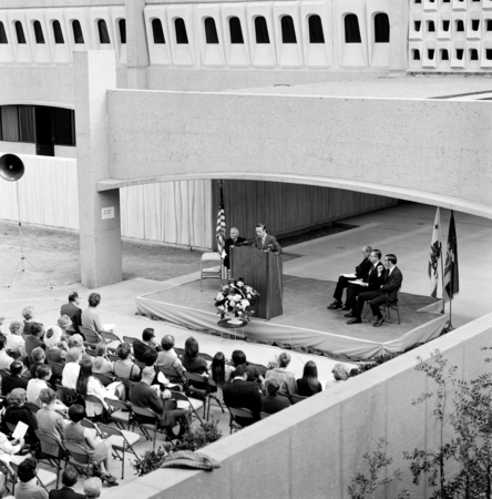 Speaker at podium during dedication of the Basic Science Building, UC San Diego