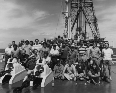Entire crew of Leg 95 on the foredeck of the D/V Glomar Challenger (ship) during the Deep Sea Drilling Project. 1983.