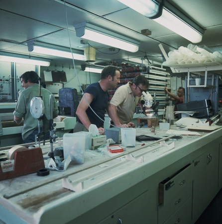 Scientists Thomas W. Connelly (center left) and Wallace Broecker (center right) working in the core laboratory aboard the ...