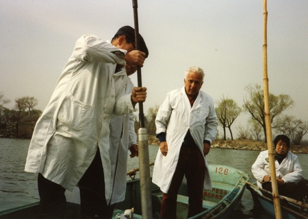 Edward D. Goldberg, (man with silver hair) doing some research work in China. Goldberg was a marine chemist at Scripps Ins...