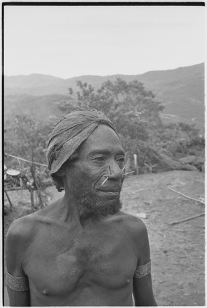 Muluwai, Maring man with pierced nose, wears barkcloth cap and armbands woven from orchid vines
