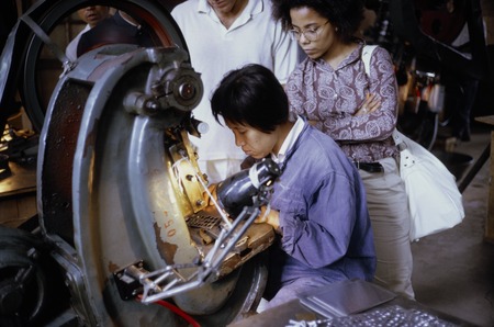Worker making metal parts
