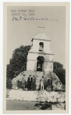 Men in front of the bell tower at Pala Mission