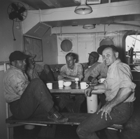 Frank Nolan, Tom Chapman, Clyde Lewis, &quot;Mike&quot; have coffee break in mess hall, R/V Horizon, MidPac Expedition