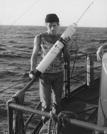 Technician Don Cameron makes a final inspection before launching a sonar-buoy during regular operations aboard D/V Glomar ...