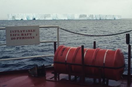 [Iceberg seen from deck of D/V Glomar Challenger. Sign on deck reads: Inflatable life raft 20 Persons] Antarctica, Leg 28