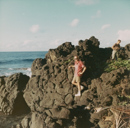 Man on pillow lava: The next day the shipborne dredging party returned to Futuna and studied the pillow lavas which form o...