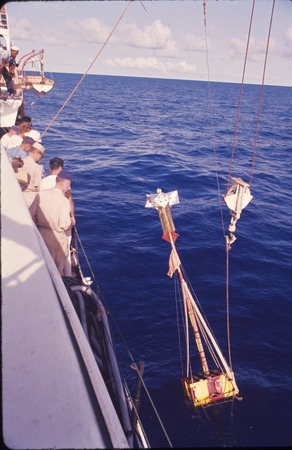 Launching or retrieving an instrument buoy, onboard the USC&amp;GS Pioneer during the International Indian Ocean Expedition. 1964