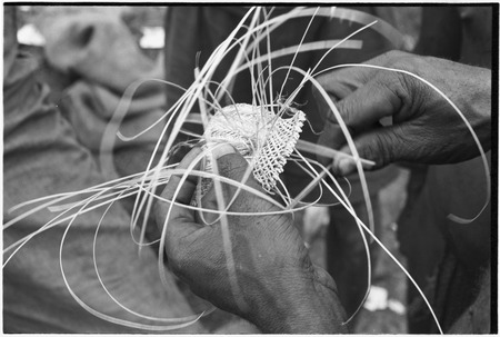Weaving: an armband is intricately woven from orchid fibers