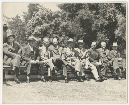 Ed Fletcher and other men seated on bench