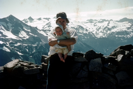 Charles D. Keeling in the Sierra Nevadas holding one of his children