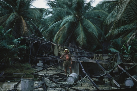Oceanographer Norman J. Holter pictured in what is left of the military Officer&#39;s Club on Bikini Island, this photo was ta...