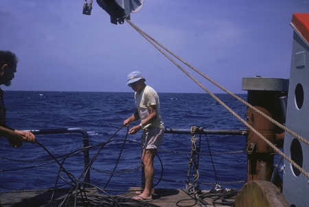 Russell Raitt (right) and George G. Shor slacking hydrophone cables. Onboard R/V Thomas Washington, Indopac Expedition. Se...