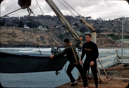 Two men deploying a boat from the pier at the Scripps Institution of Oceanography
