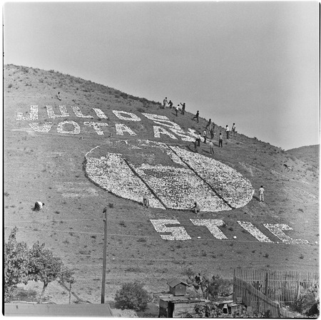 Political propaganda being placed on a Tijuana hillside